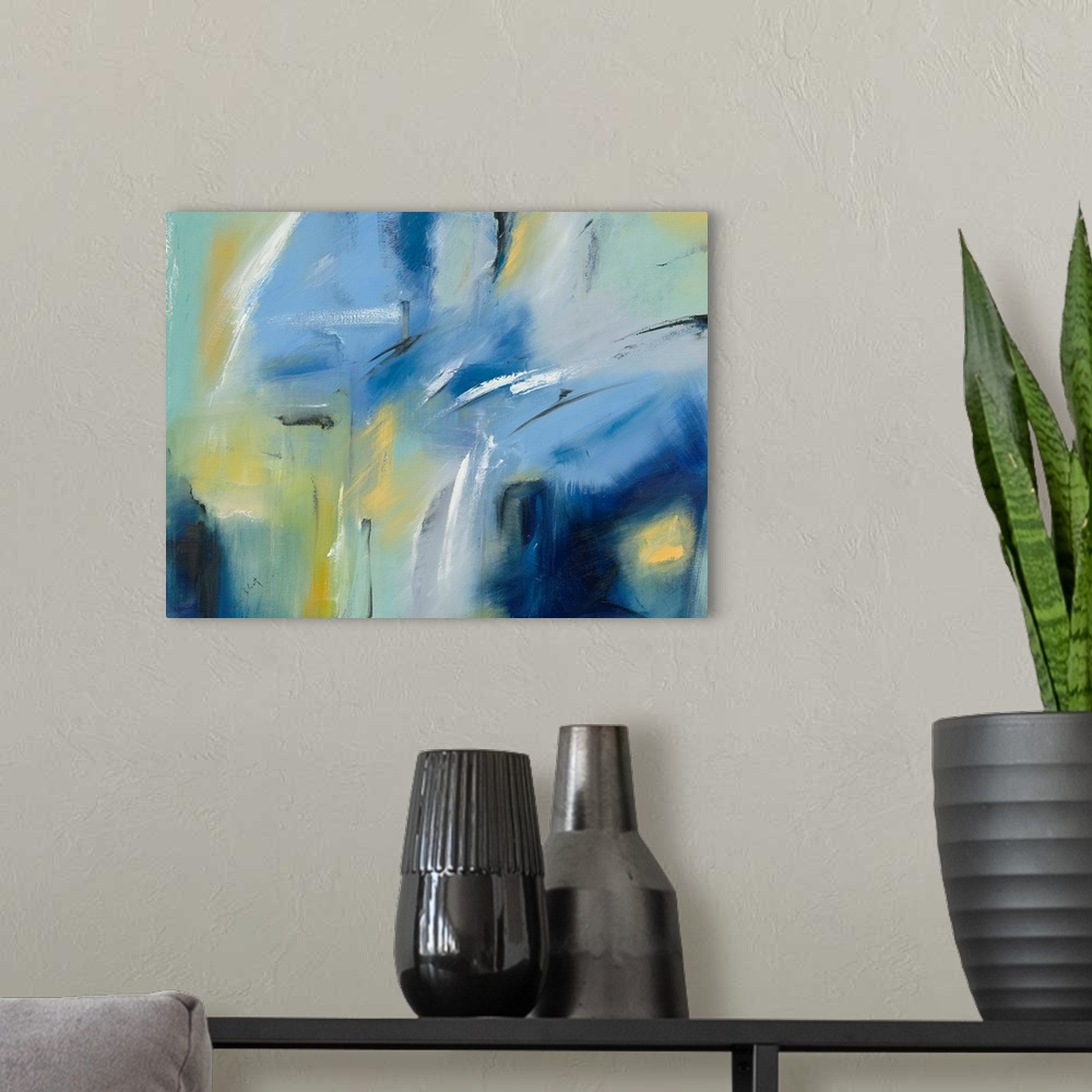 A modern room featuring Large blue, green, and yellow abstract painting with black and white brushstrokes on top creating...