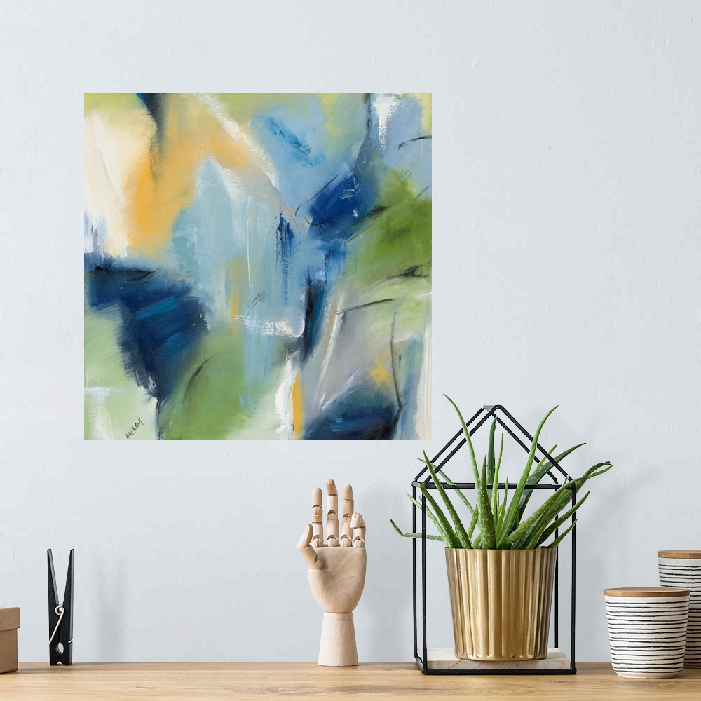 A bohemian room featuring Square blue, green, and yellow abstract painting with black and white brushstrokes on top creatin...