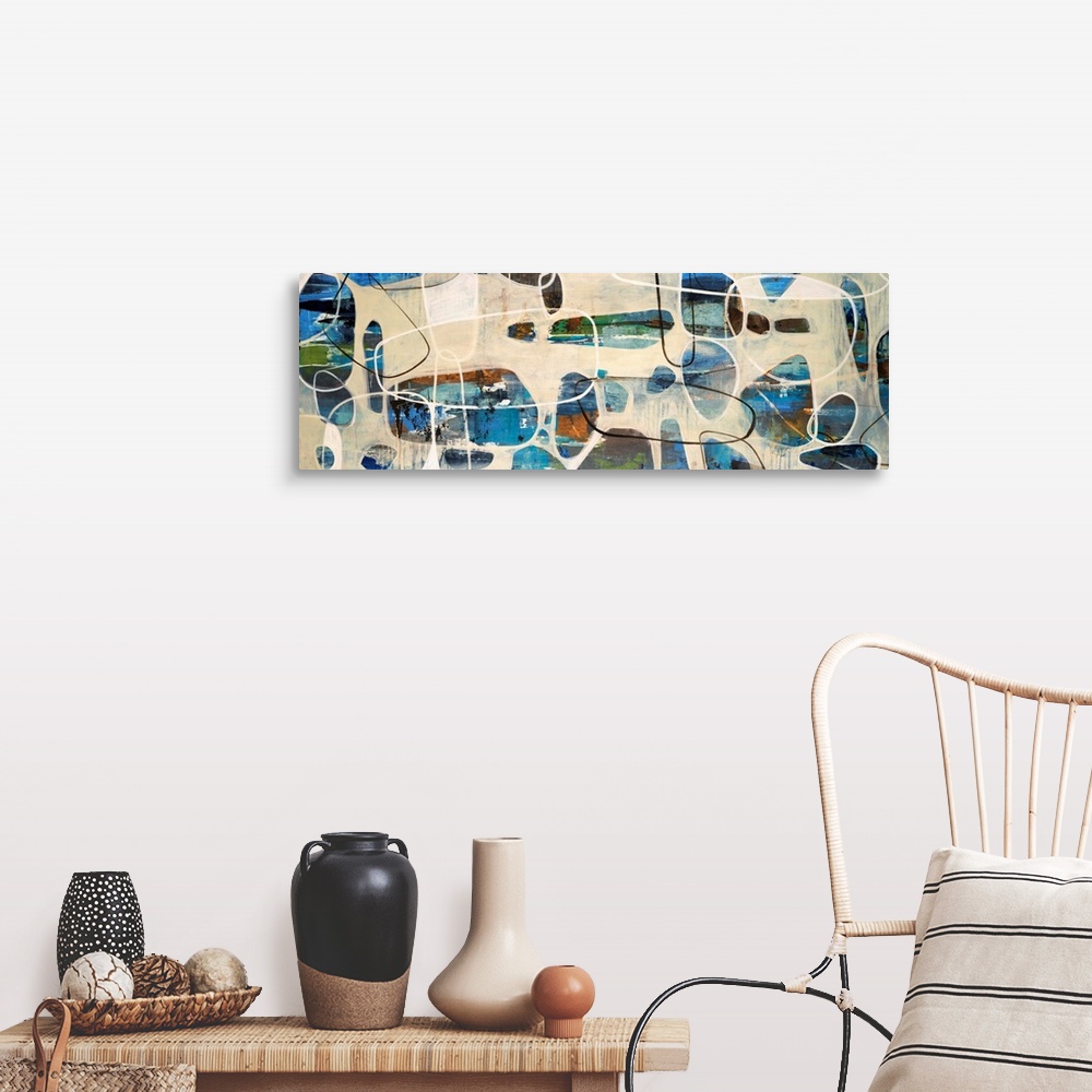 A farmhouse room featuring Abstract painting of oval, stone like shapes scattered on a panoramic sized art canvas.