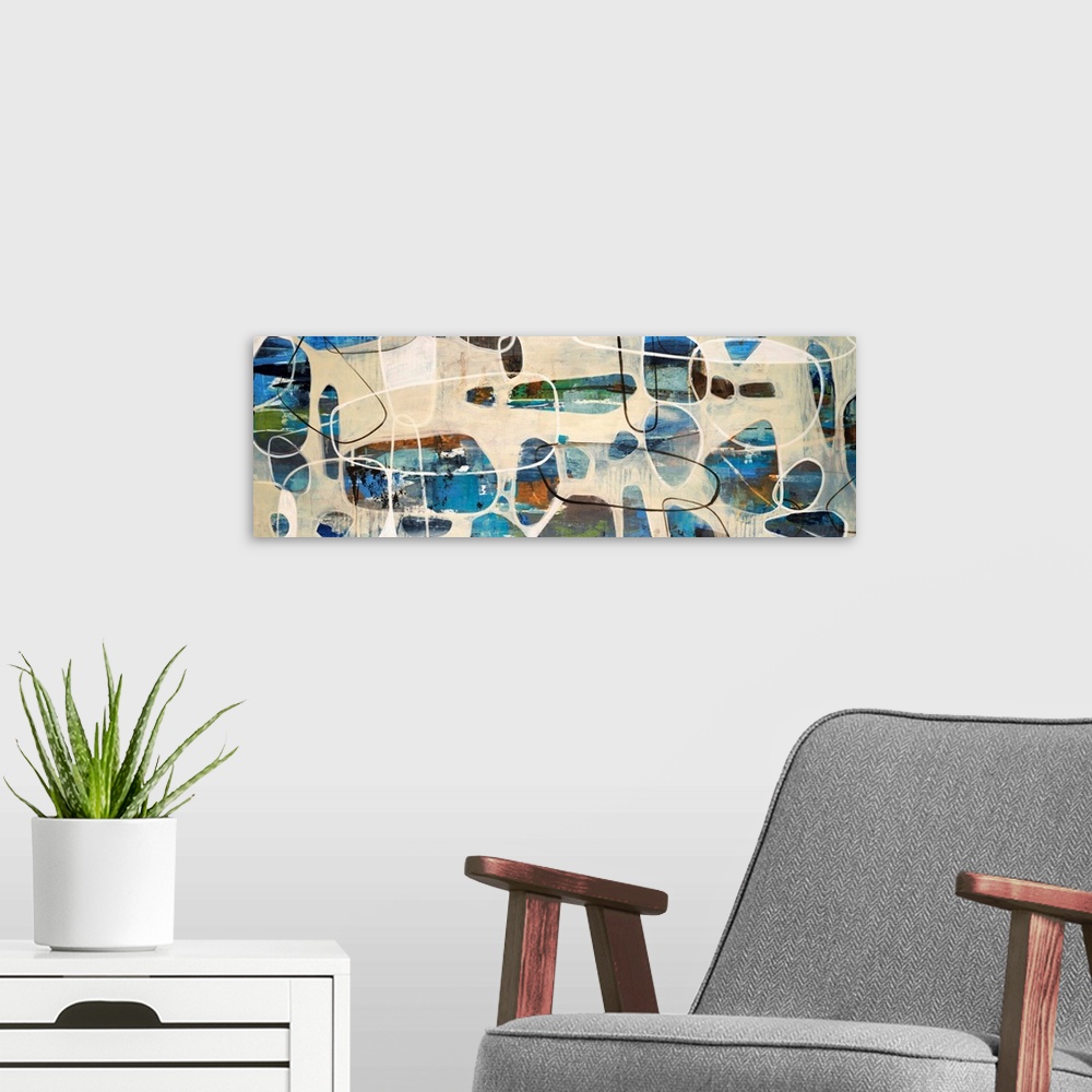 A modern room featuring Abstract painting of oval, stone like shapes scattered on a panoramic sized art canvas.