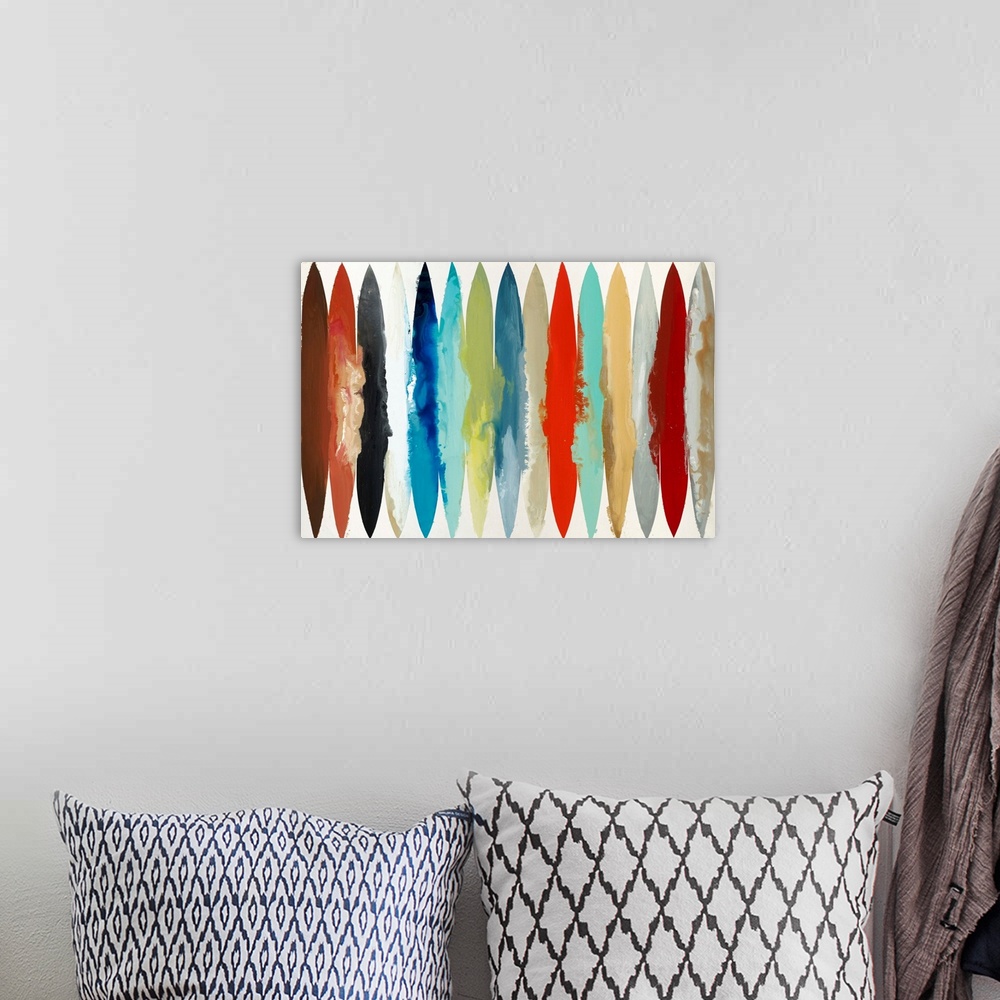 A bohemian room featuring Large abstract painting with different colored oblong shapes lined up together going across the c...