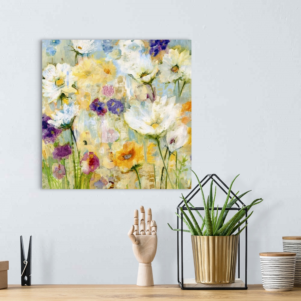 A bohemian room featuring A painting of garden flowers in shades of yellow, orange and purple.