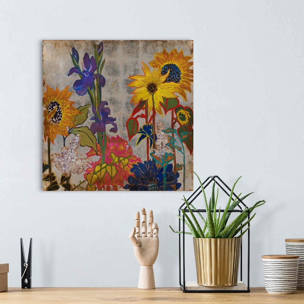 A bohemian room featuring A square painting of primary colored wild flowers in a garden with a silver square patterned back...