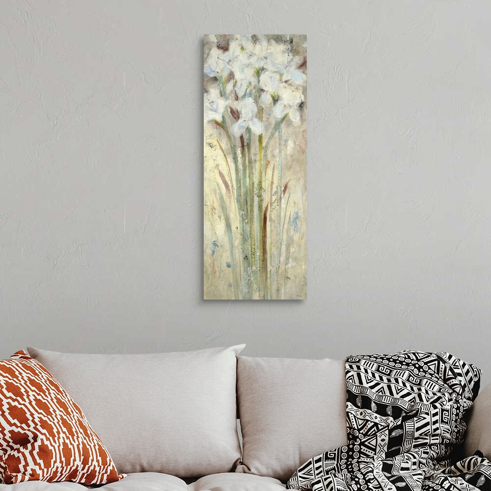 A bohemian room featuring A contemporary painting of white flowers.