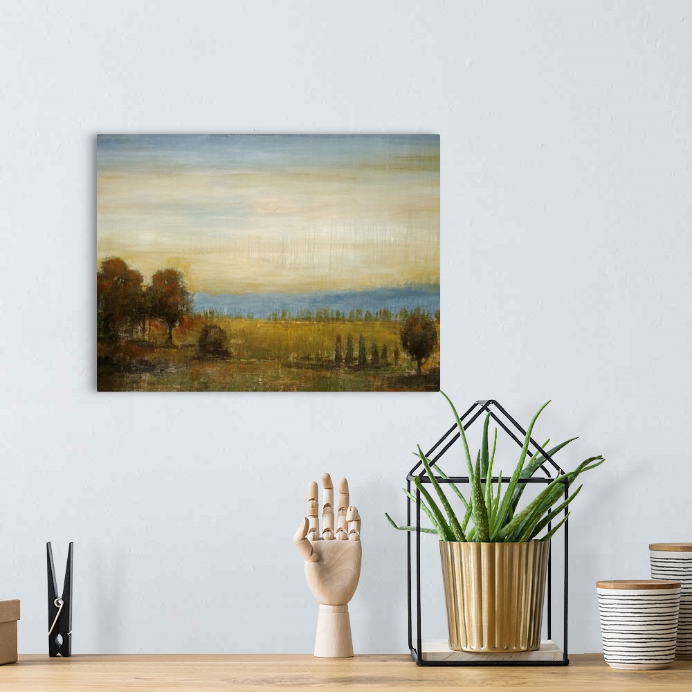 A bohemian room featuring Painting on canvas of a field with a bunch of trees and a rolling hill in the distance.