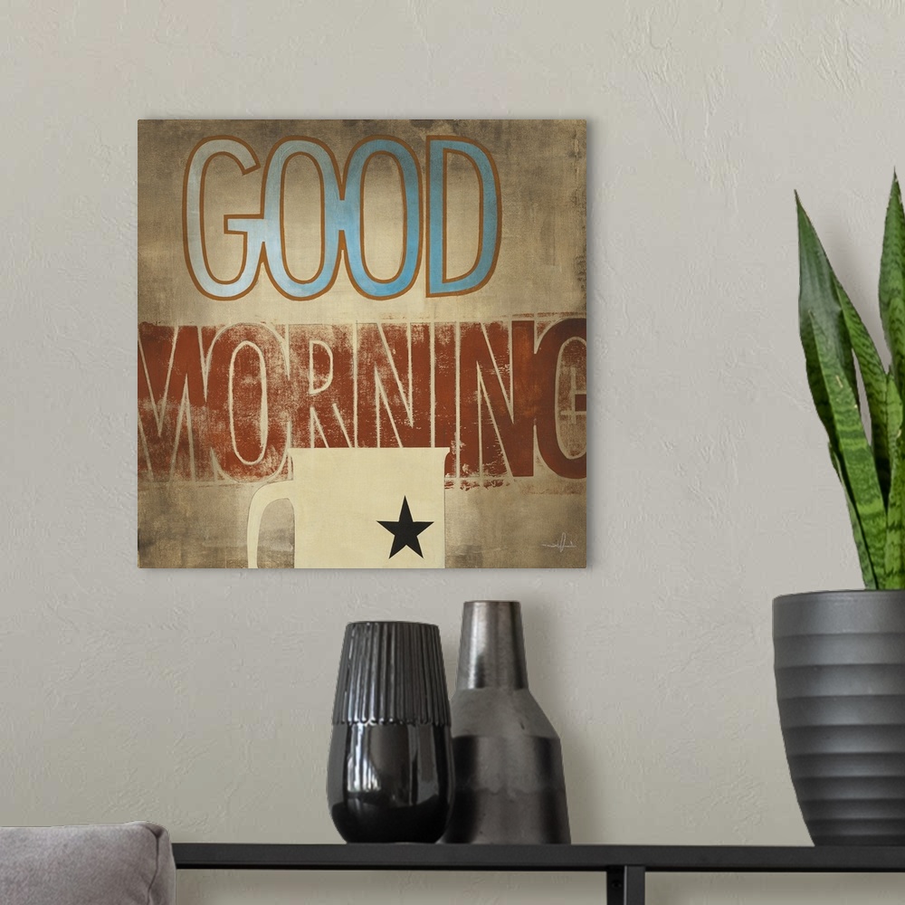 A modern room featuring Decorative artwork of a cup of coffee with the text "Good Morning" in rustic browns and blue.