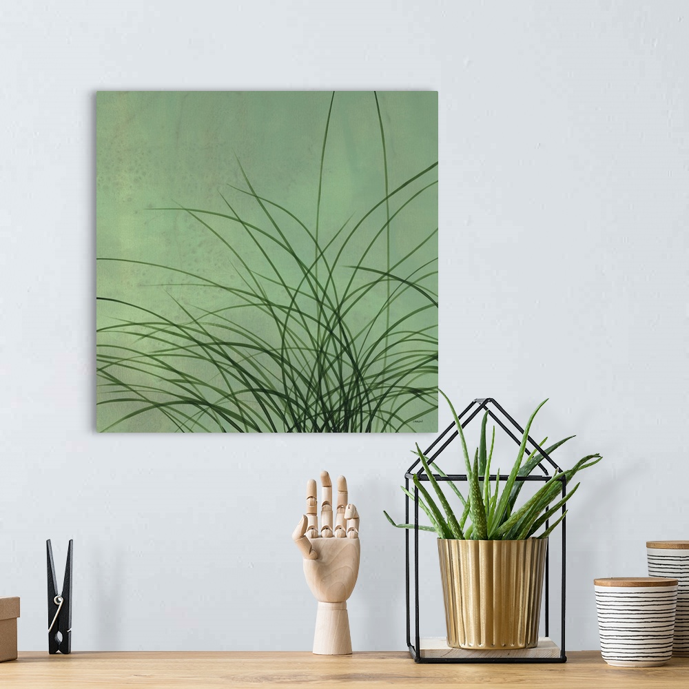 A bohemian room featuring Square artwork with long, thin, green grass blades on a lighter green background.