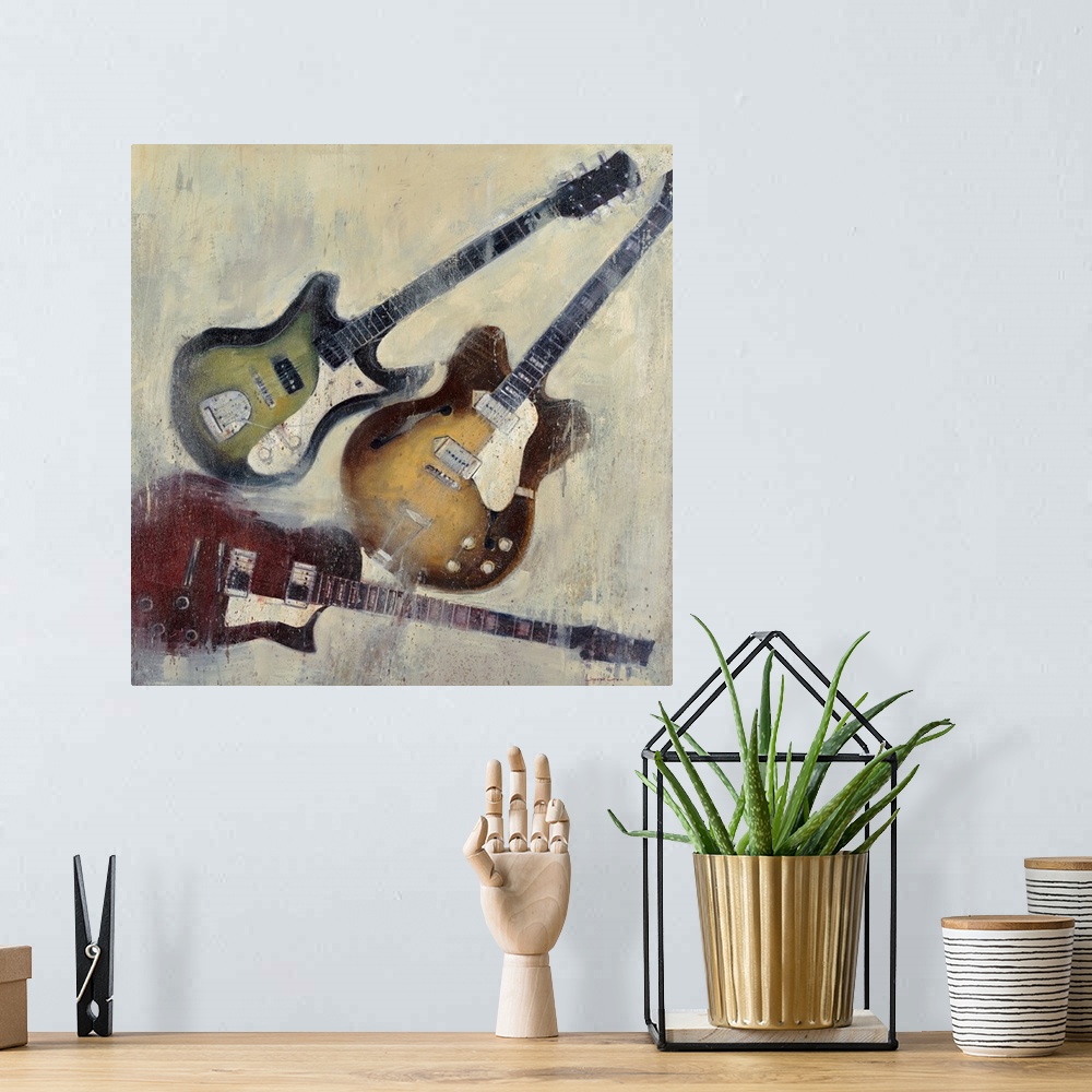 A bohemian room featuring Painting of three different color guitars on a textured neutral color background.