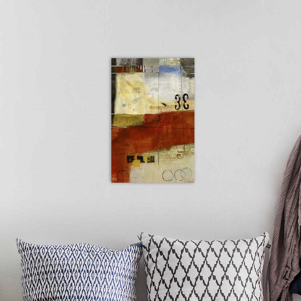 A bohemian room featuring Contemporary abstract painting using rich earth tons and geometric shapes.