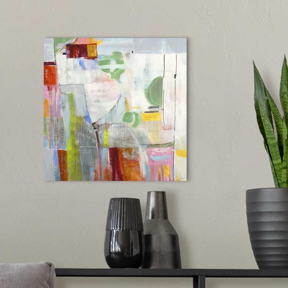 A modern room featuring Contemporary abstract painting using vibrant colors and geometric shapes.