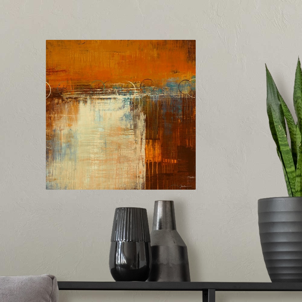 A modern room featuring Square, abstract painting in warm earth tones of patchy, layered colors with small drips running ...