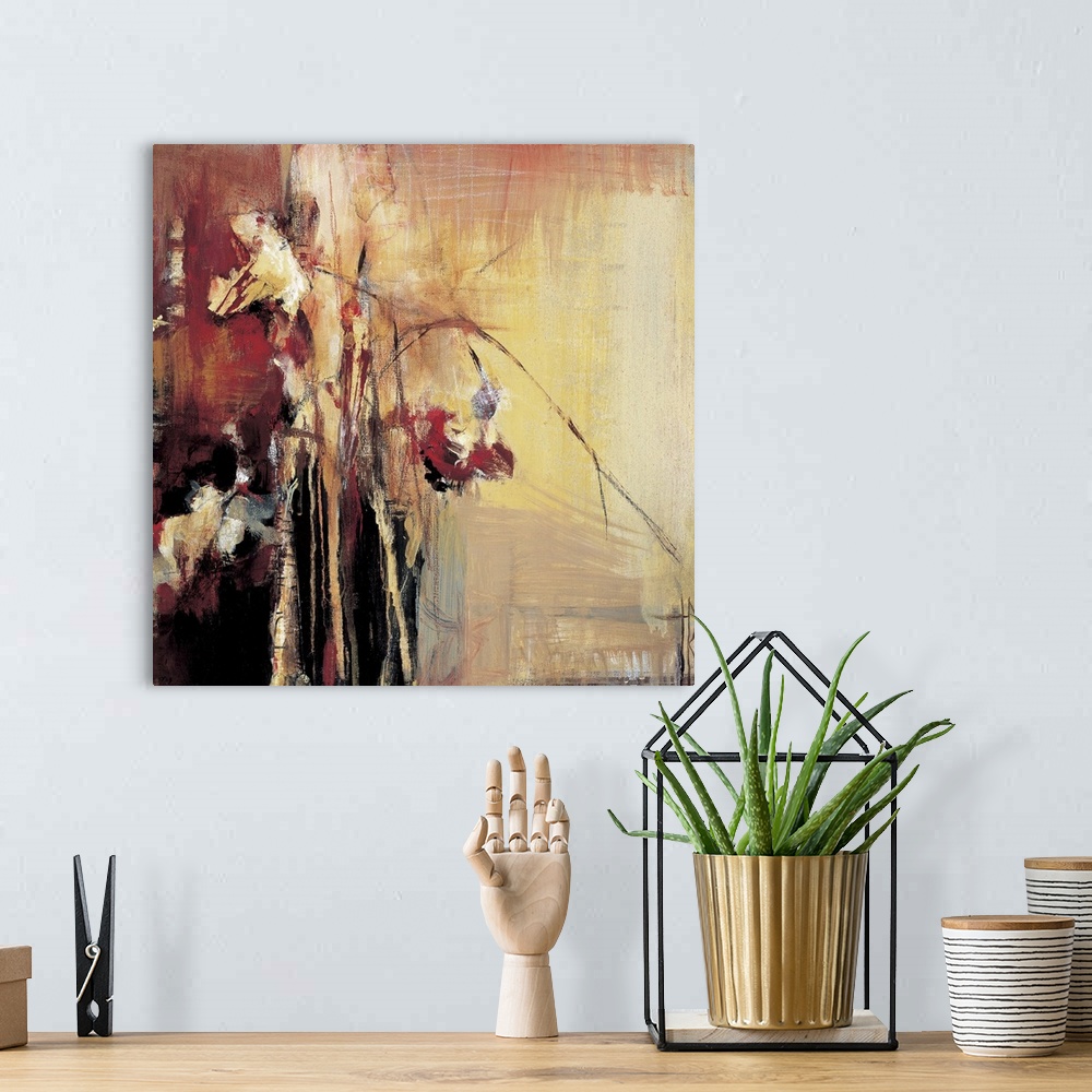 A bohemian room featuring Warm tones and rough looking textures give this abstract painting depth.