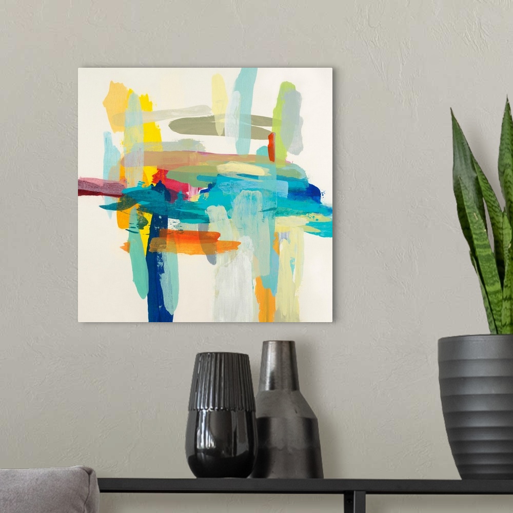 A modern room featuring Square abstract painting with layered horizontal and vertical brushstrokes in various vibrant col...