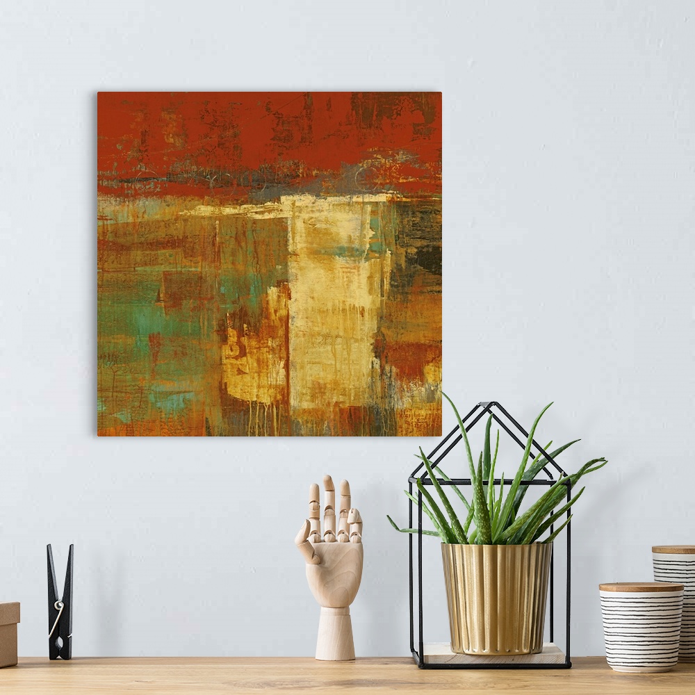 A bohemian room featuring Abstract artwork that uses lots of warmer tones and blocks of painting. Some of the paint has dri...