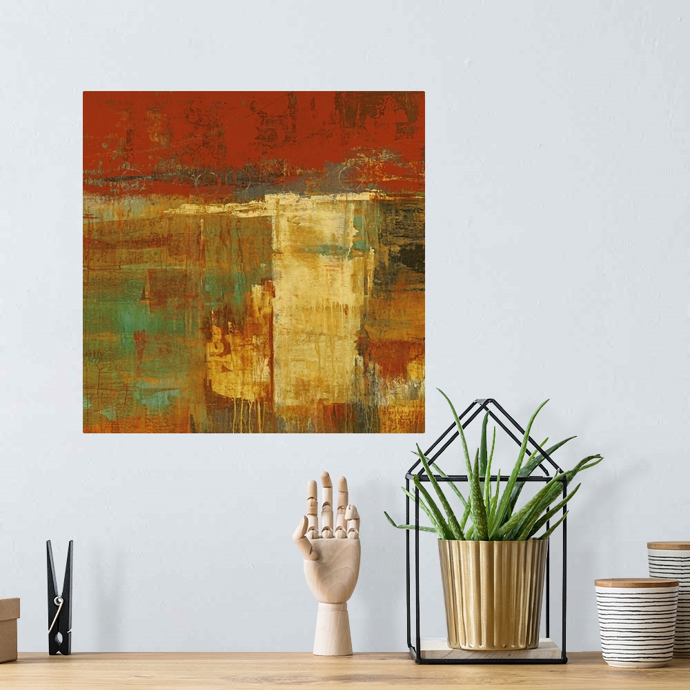 A bohemian room featuring Abstract artwork that uses lots of warmer tones and blocks of painting. Some of the paint has dri...