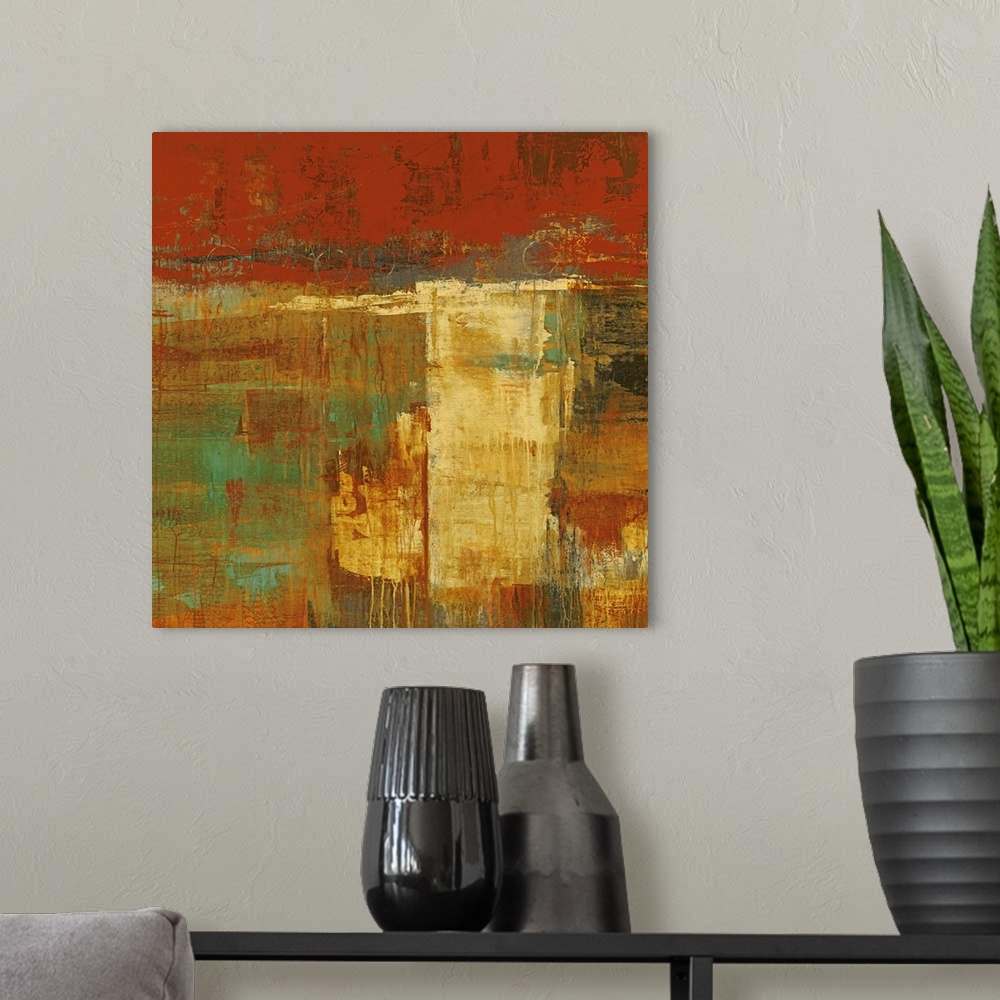 A modern room featuring Abstract artwork that uses lots of warmer tones and blocks of painting. Some of the paint has dri...