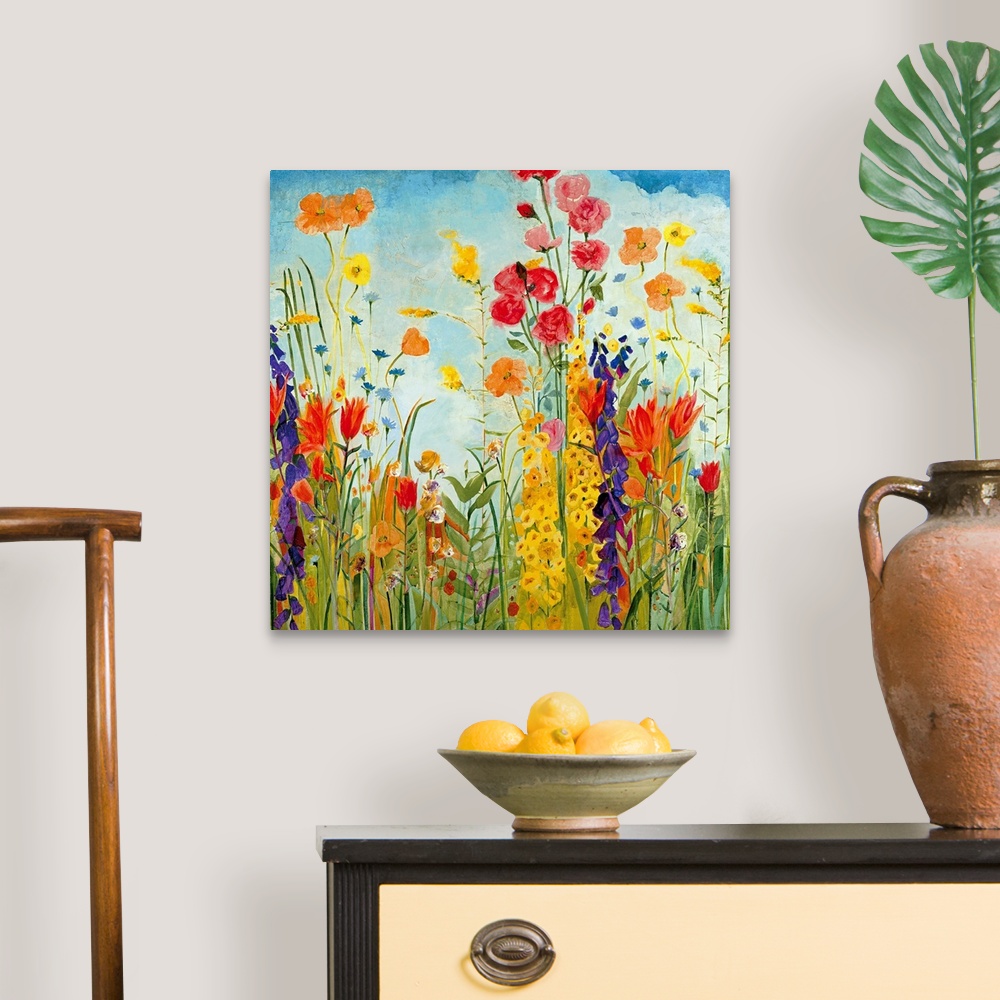 A traditional room featuring A square, contemporary painting of a variety of flowers on a sunny day. Floral wall art perfect f...