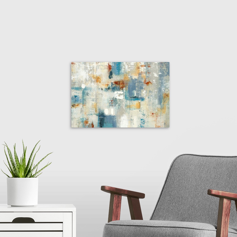 A modern room featuring Large abstract painting with shades of blue, yellow, orange, gray, and white.