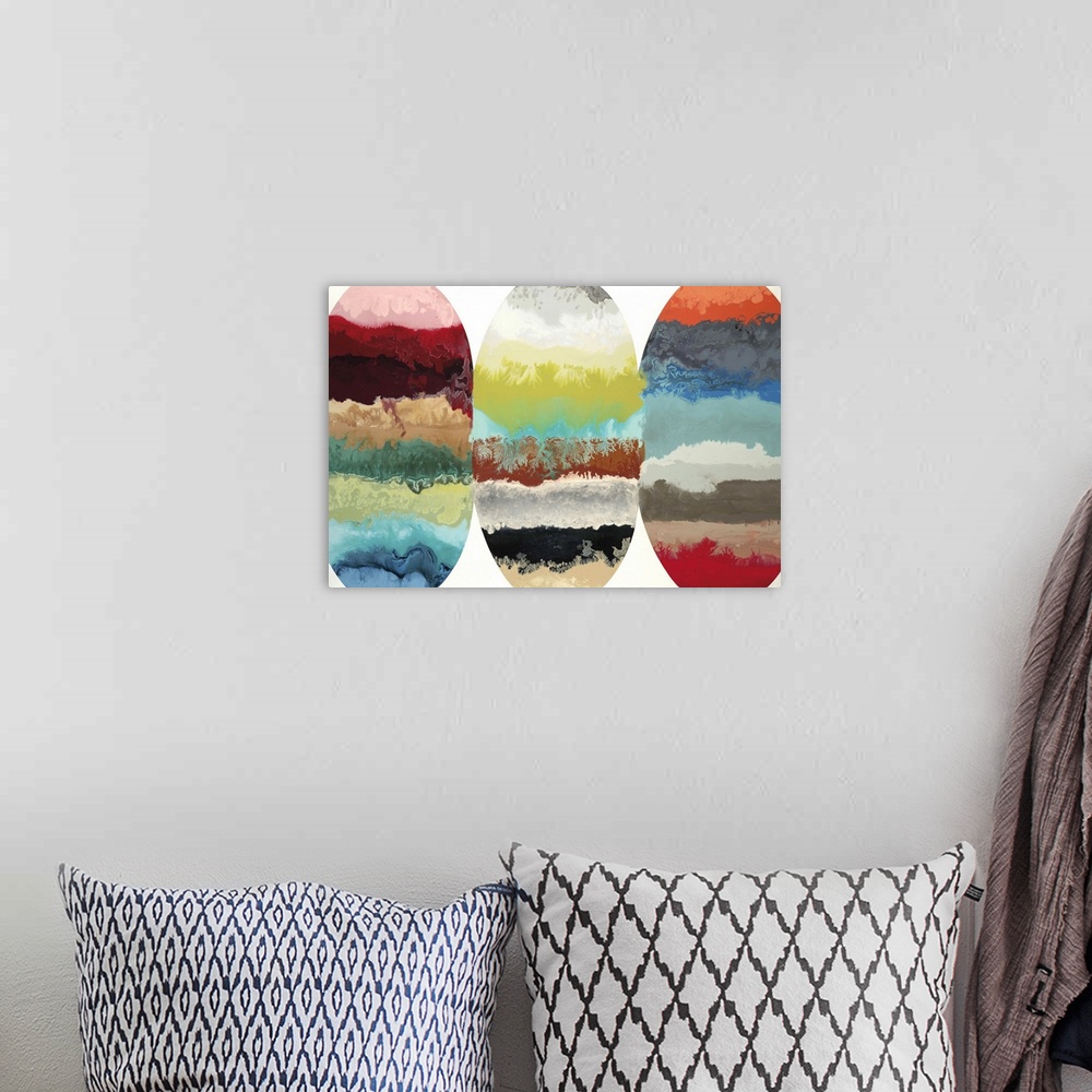 A bohemian room featuring Contemporary abstract painting of three oblong oval shapes with multiple colors and textures in t...