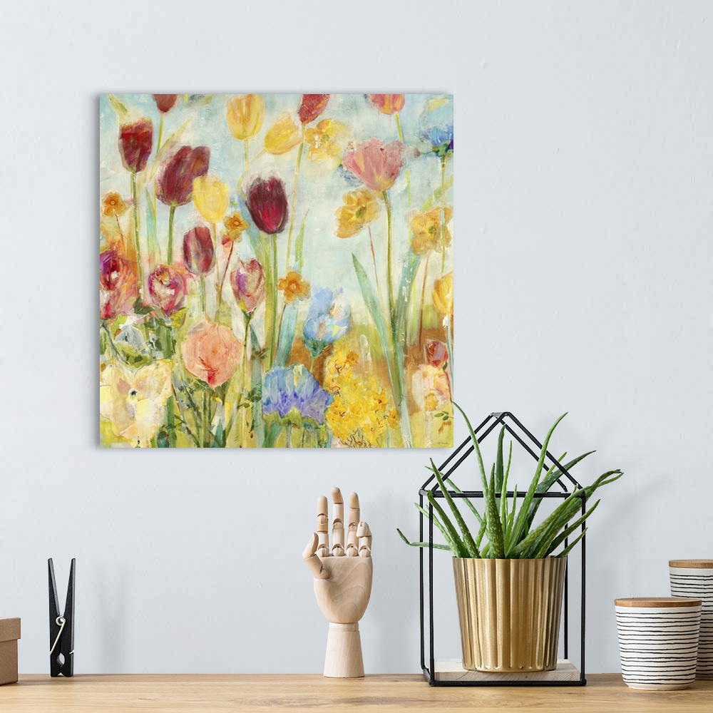 A bohemian room featuring A painting o vibrant garden flowers rising high on bright green stems.