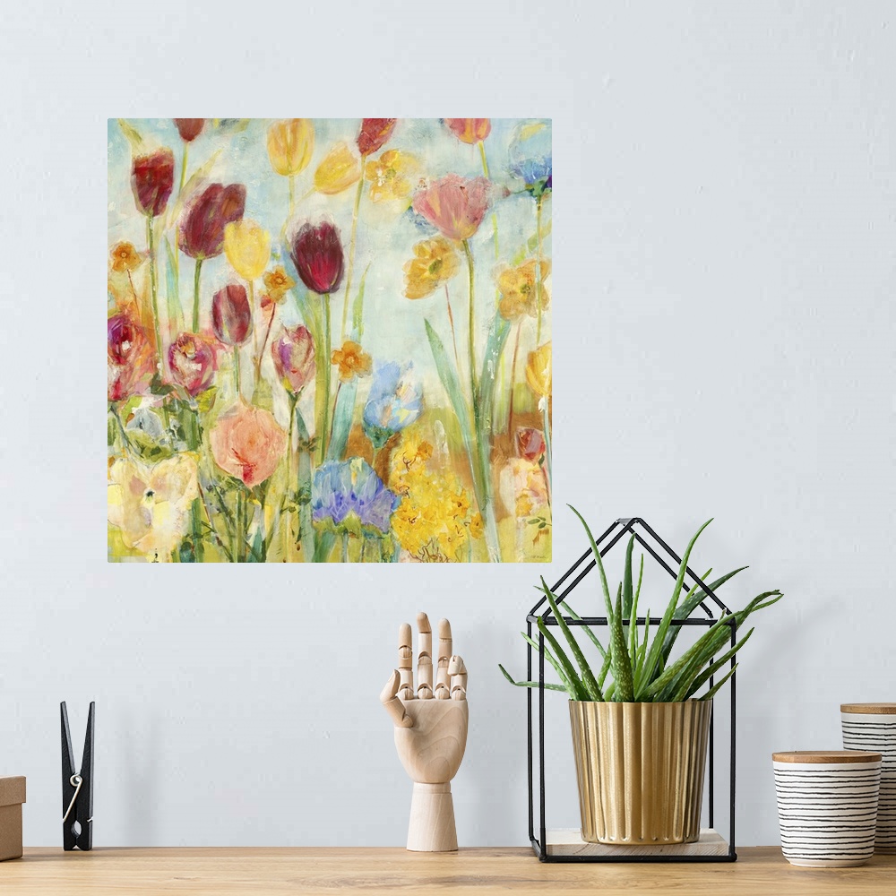 A bohemian room featuring A painting o vibrant garden flowers rising high on bright green stems.