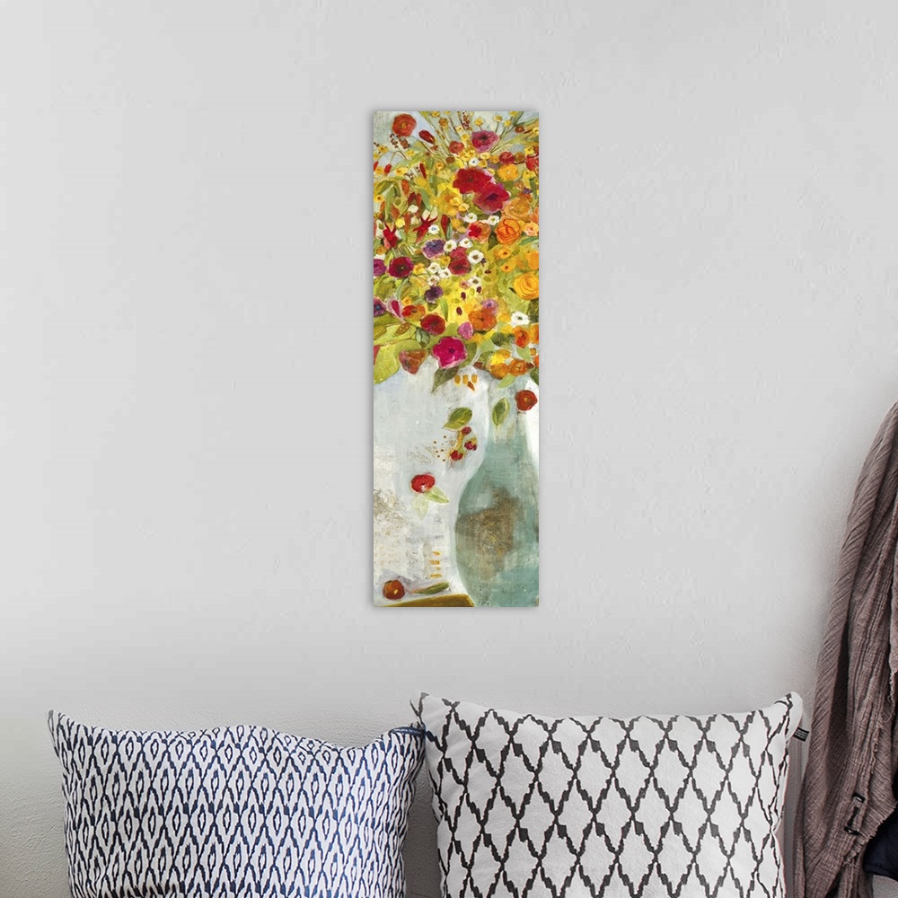 A bohemian room featuring A contemporary painting of a pale blue vase holding flowers in red orange and yellow tones.