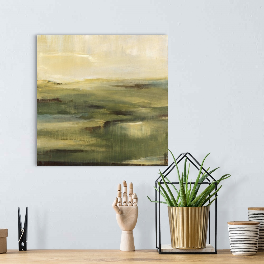 A bohemian room featuring Contemporary abstract painting of a muted green landscape under a neutral toned sky.