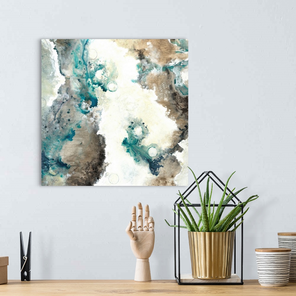 A bohemian room featuring Square abstract painting with marbling colors in shades of brown, gray, cream, and blue.