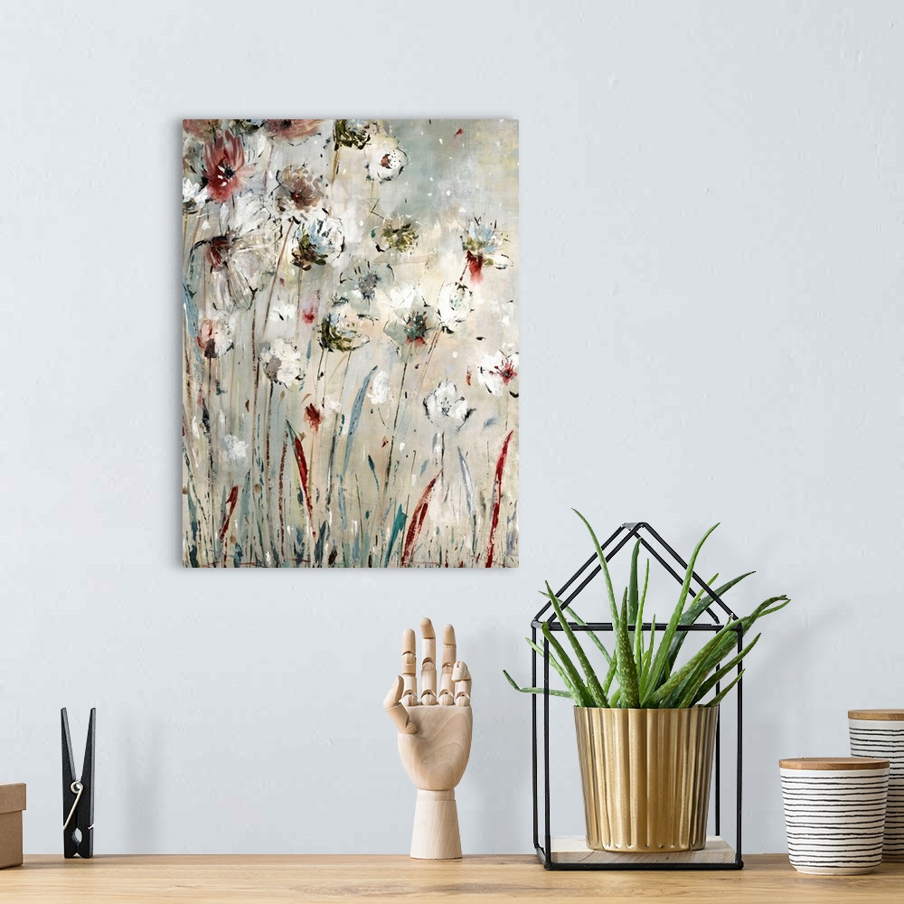 A bohemian room featuring Abstract painting of long stemmed flowers in shades of red, blue, white, and gray with a little b...