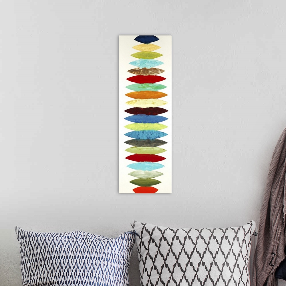 A bohemian room featuring Vertical panoramic abstract painting with different colored oblong shapes lined up together going...