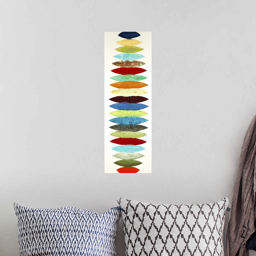 A bohemian room featuring Vertical panoramic abstract painting with different colored oblong shapes lined up together going...