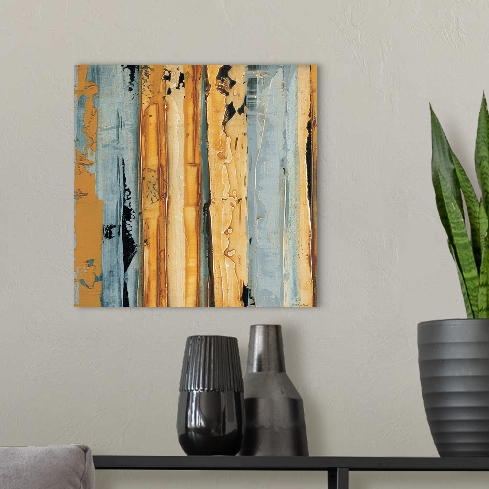 A modern room featuring Contemporary abstract painting using gold and pale gray in vertical lines.