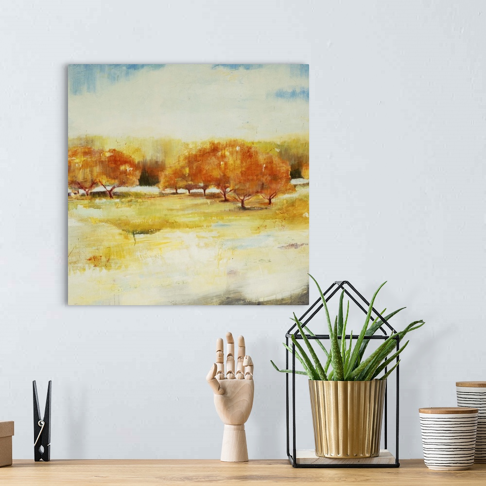A bohemian room featuring Contemporary landscape painting looking out over autumn foliage.