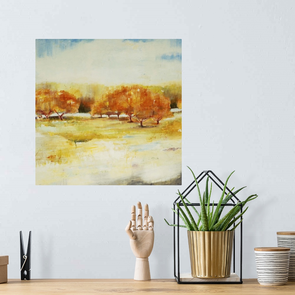 A bohemian room featuring Contemporary landscape painting looking out over autumn foliage.