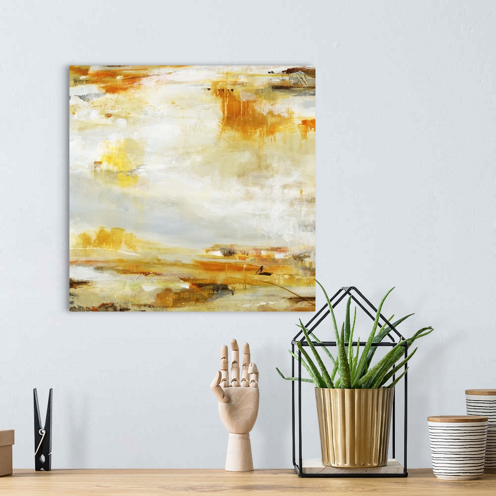 A bohemian room featuring A contemporary abstract painting of splashes of golden orange and brown against a neutral backgro...