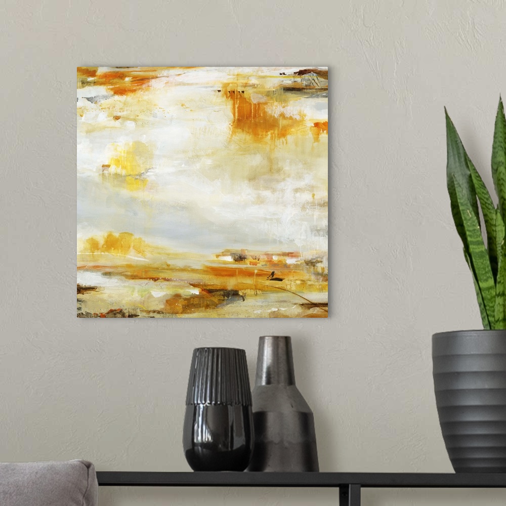 A modern room featuring A contemporary abstract painting of splashes of golden orange and brown against a neutral backgro...