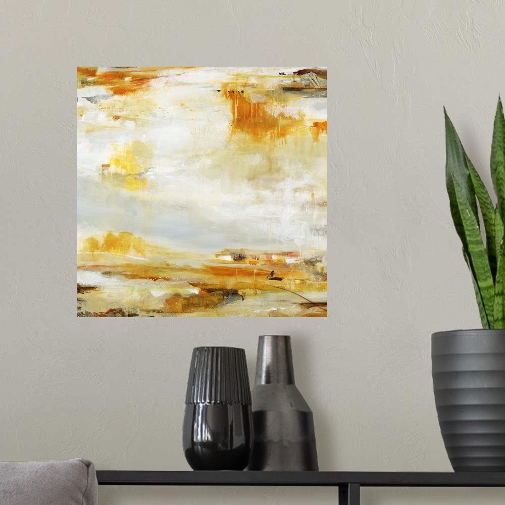 A modern room featuring A contemporary abstract painting of splashes of golden orange and brown against a neutral backgro...