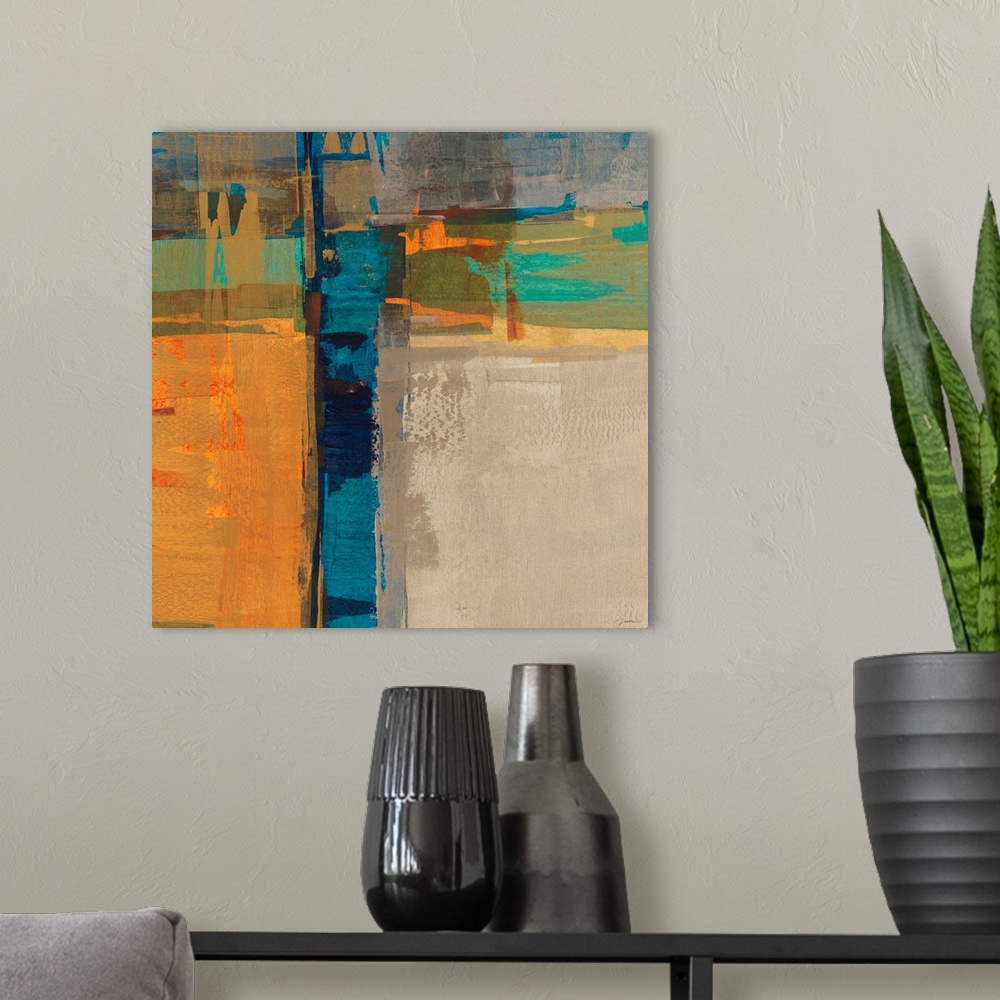 A modern room featuring A bright square abstract painting of thick crossing colors of orange, blue, yellow and green.