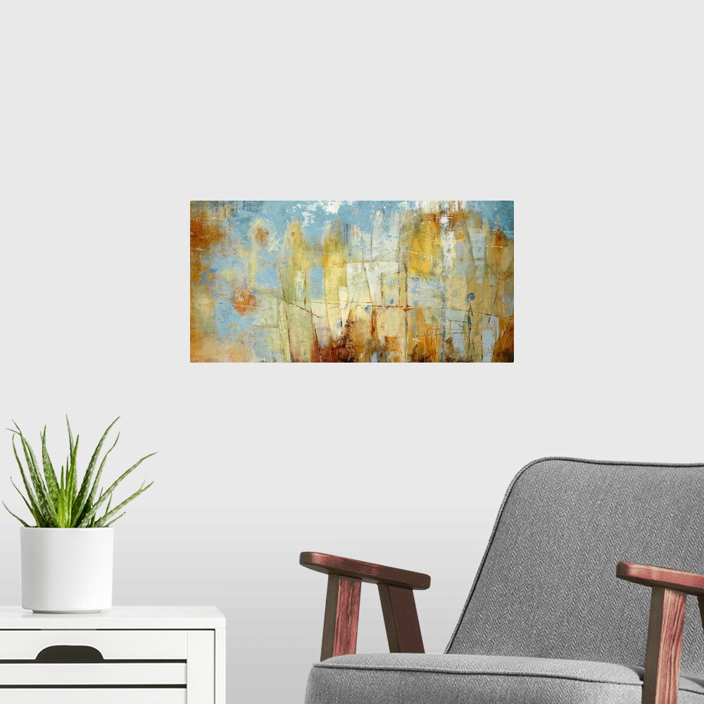 A modern room featuring Oversized landscape contemporary art with patchy areas of varying rust colored shapes on a blue b...
