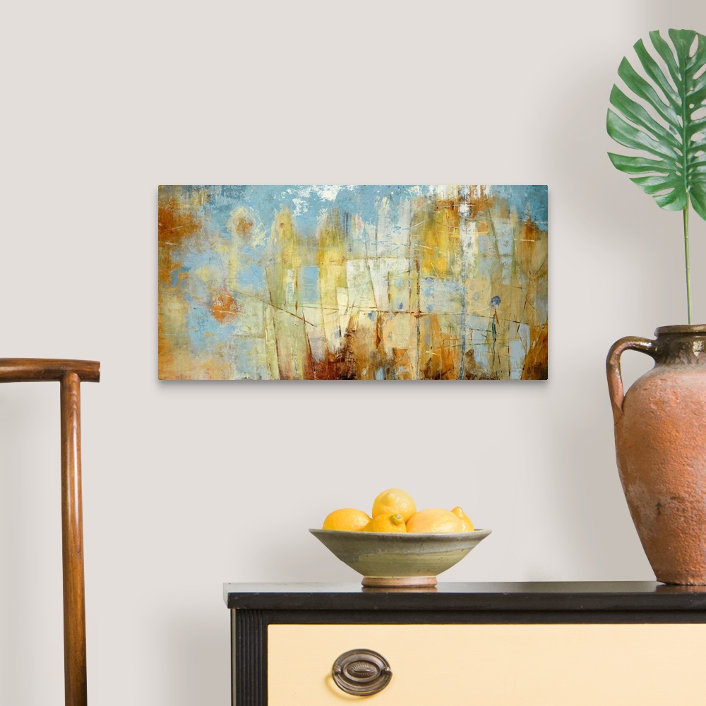 A traditional room featuring Oversized landscape contemporary art with patchy areas of varying rust colored shapes on a blue b...