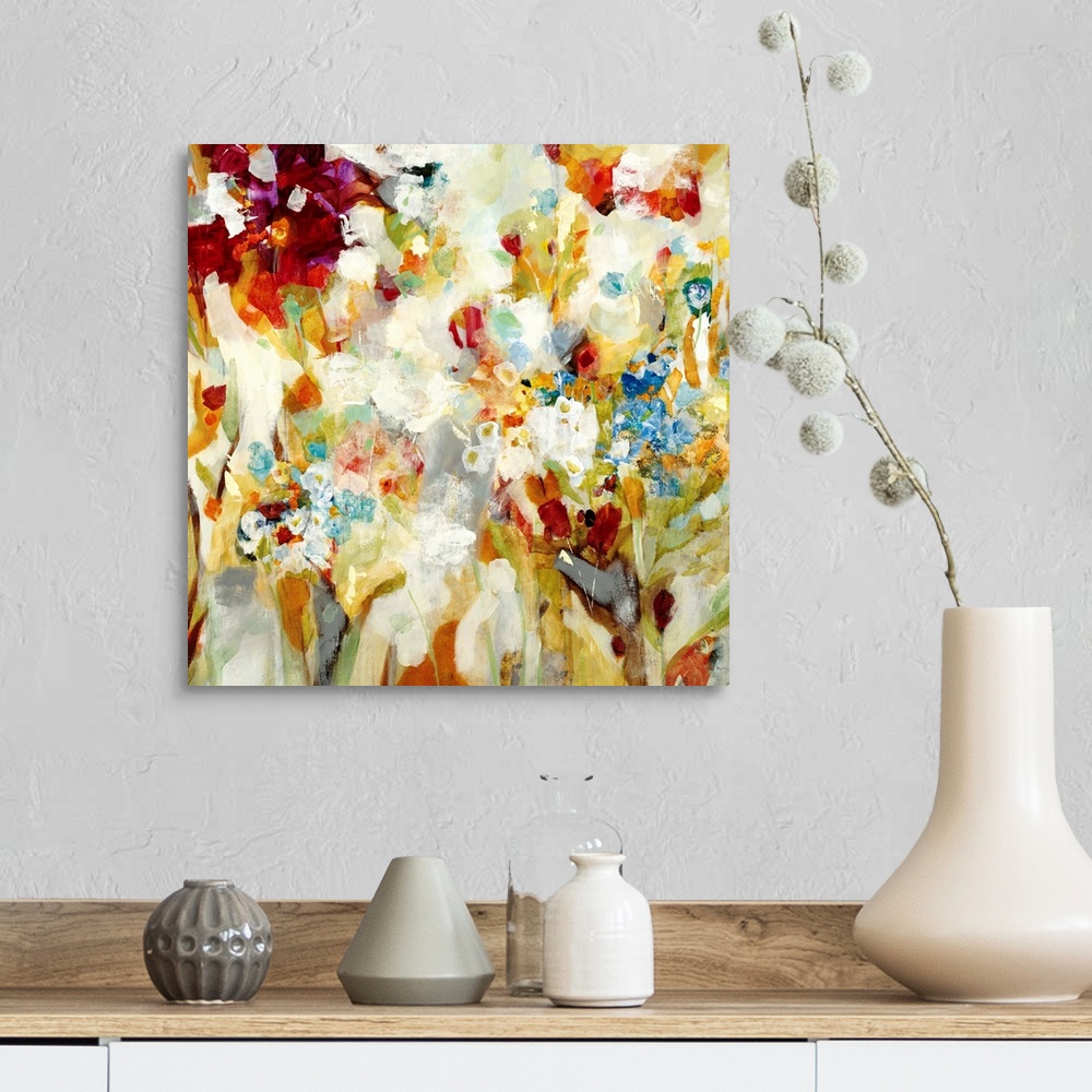 A farmhouse room featuring An abstract piece that has a variety of colors painted loosely to resemble flowers.