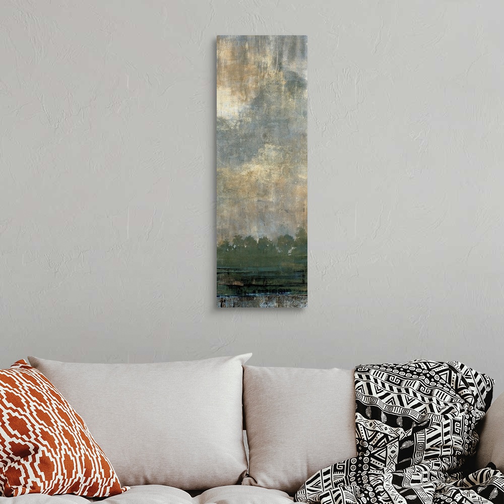 A bohemian room featuring Contemporary painting of a line of trees with green foliage under a cloud filled sky.