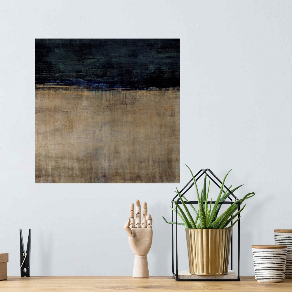 A bohemian room featuring Contemporary abstract painting using earth tones and dark blue to make a color field.