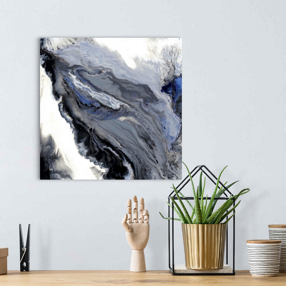 A bohemian room featuring Gray, white, blue, and black hues marbling together on a square canvas.