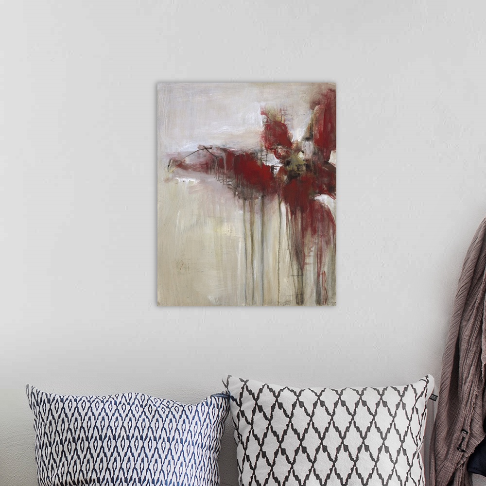 A bohemian room featuring Contemporary abstract painting using deep red tones dripping against a neutral toned background.