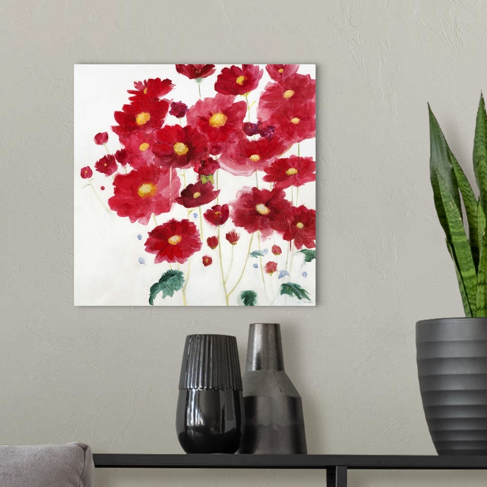 A modern room featuring A contemporary painting of vibrant red flowers against a white background.