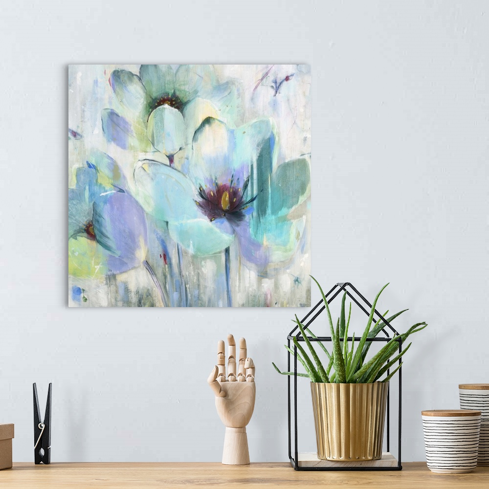 A bohemian room featuring A contemporary painting of aqua blue and teal flowers against an abstract colorful background.