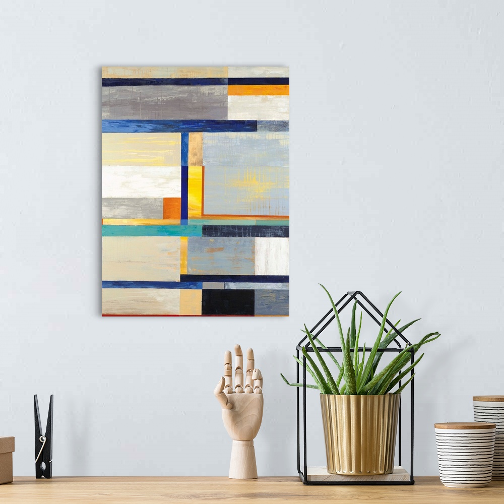A bohemian room featuring A contemporary abstract painting using colorful geometric forms.