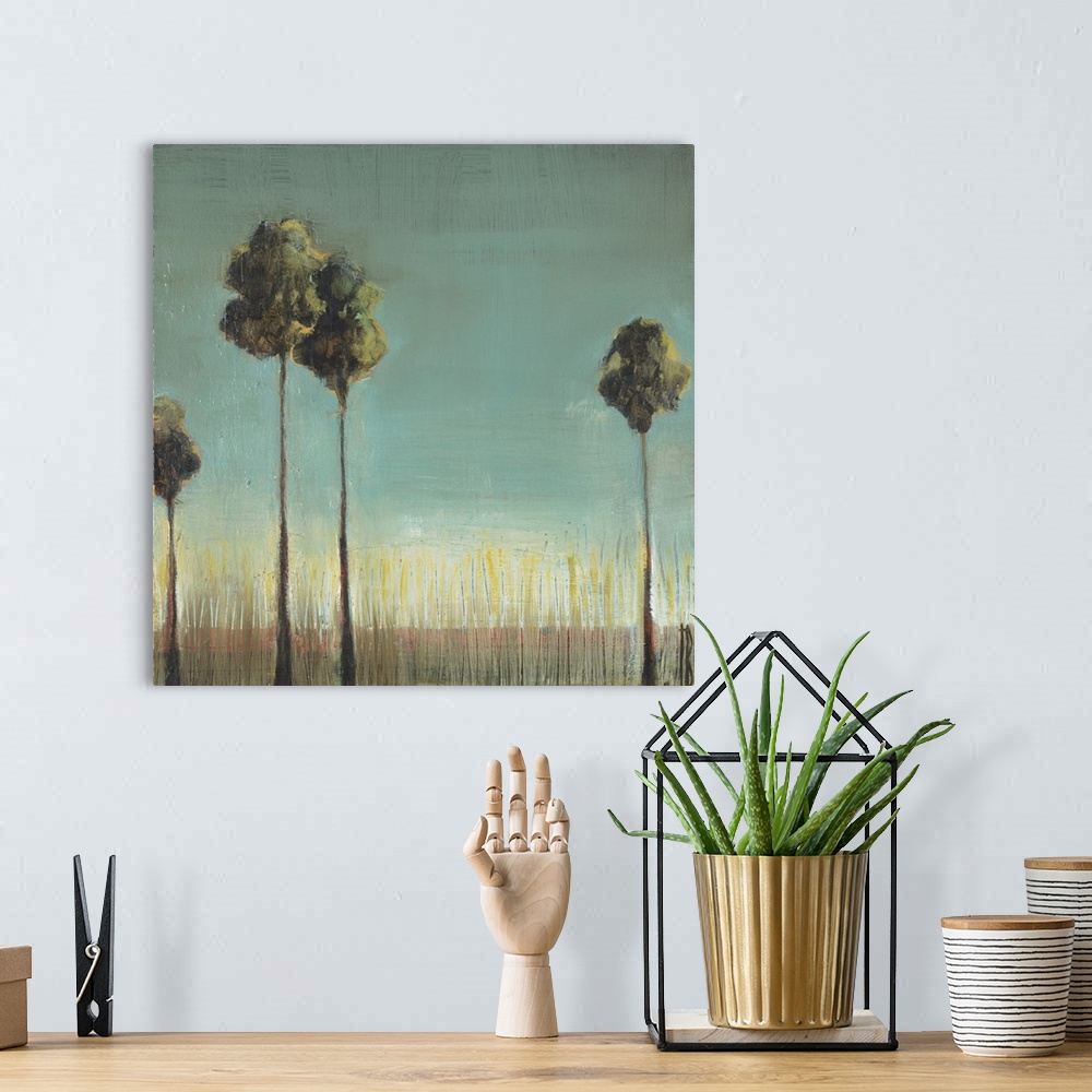 A bohemian room featuring A contemporary painting of two tall thin palm trees standing against a sea blue background.