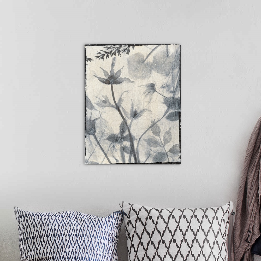 A bohemian room featuring Vertical contemporary painting of flowers in faded shades of grey with a rough, simple black border.
